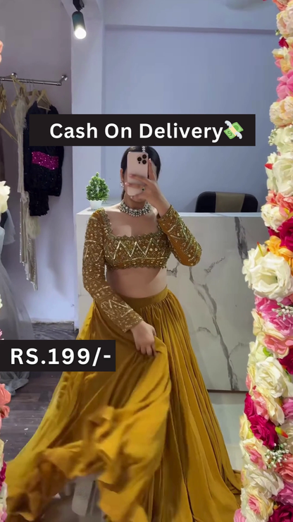 Golden Embroidered Blouse with Mustard Pleated Lehenga – Breezy Festive Style with Floral Mirror Selfie Vibes