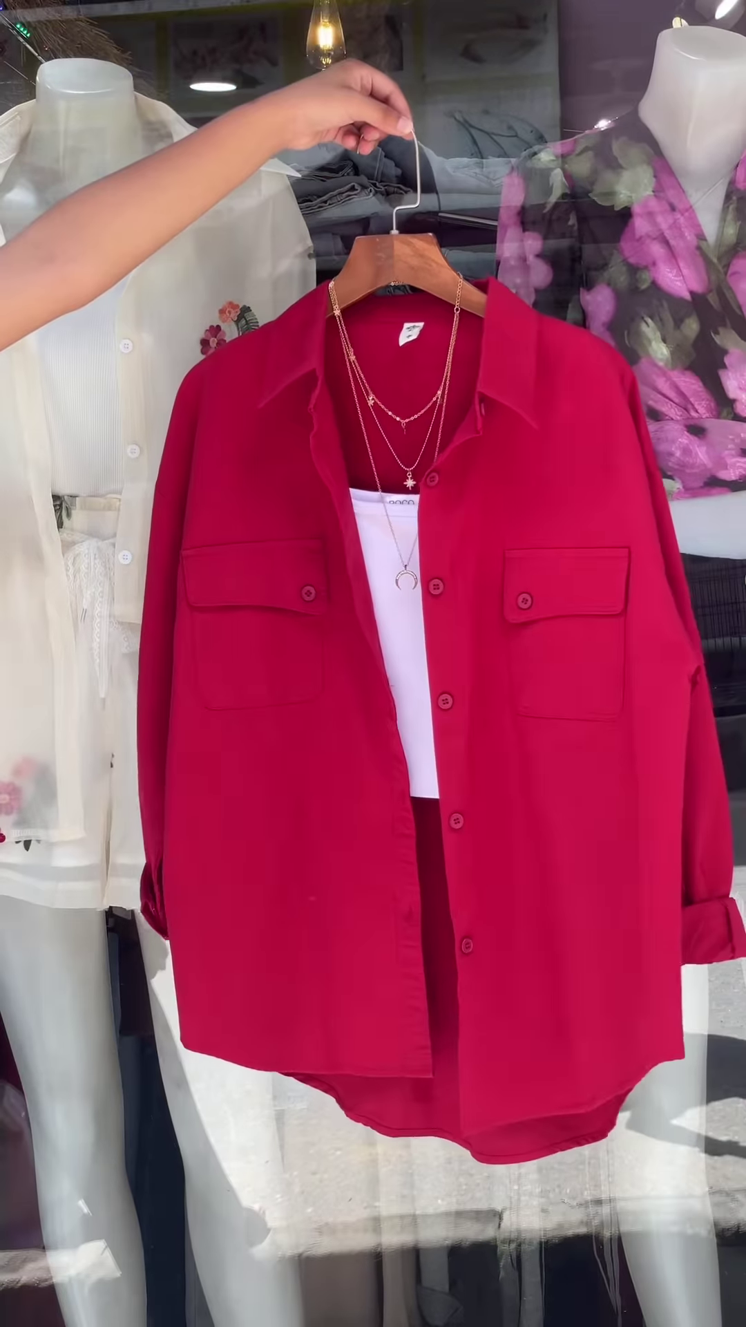 White Embroidered Shirt with Layered Styling – Boutique Elegance in a Window Display