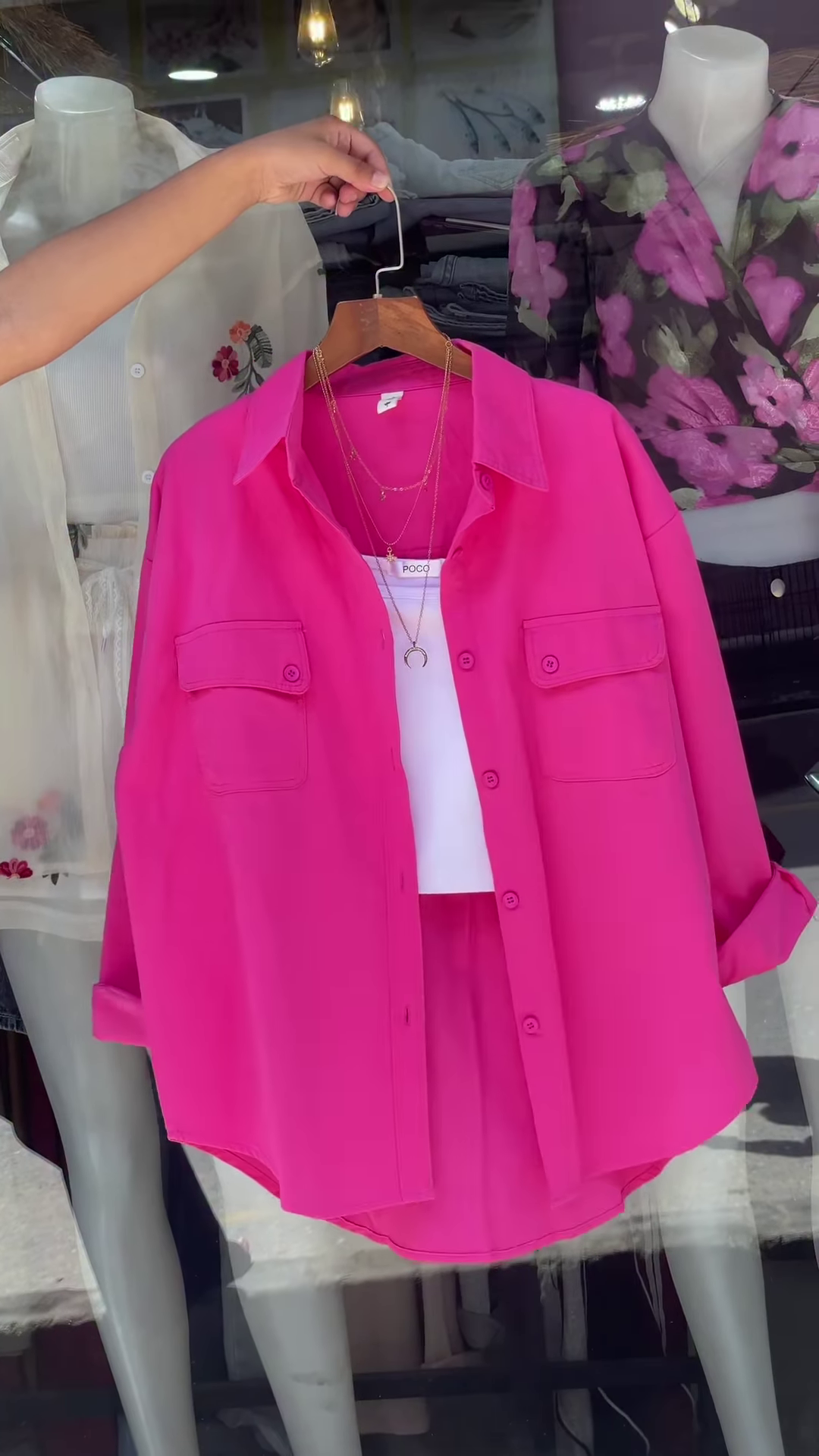 White Embroidered Shirt with Layered Styling – Boutique Elegance in a Window Display